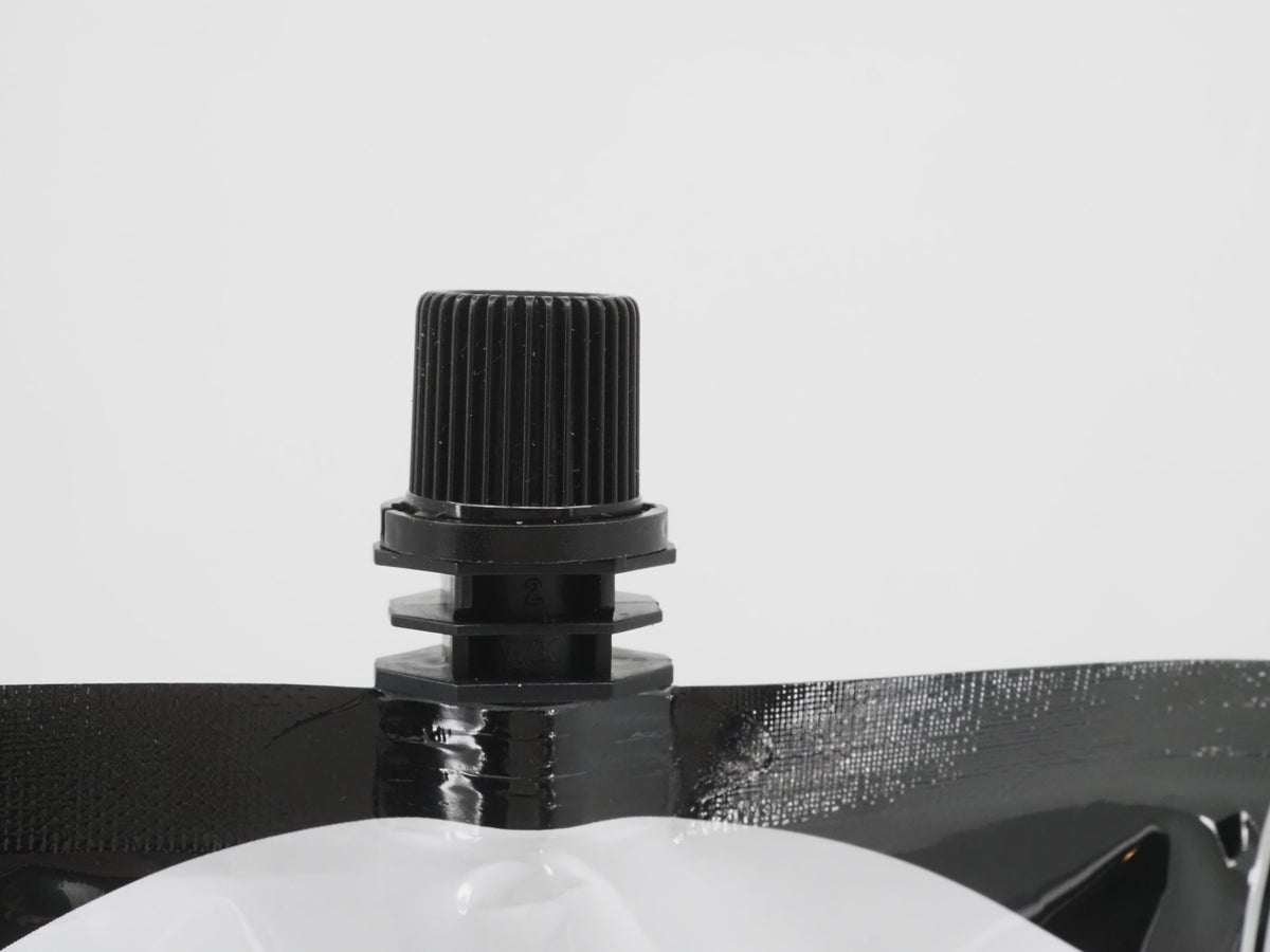 Close-up of the resealable screw cap on a COLDBRUH cold brew pouch