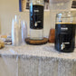 COLDBRUH cold brew glass dispensers set up on an event table with cups