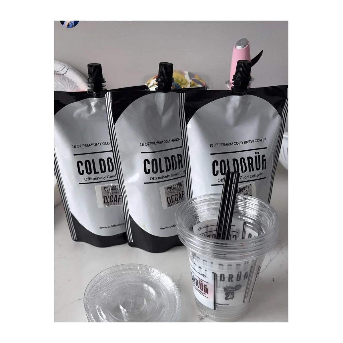 COLDBRUH 18oz cold brew pouches with branded plastic cups, lids and straws
